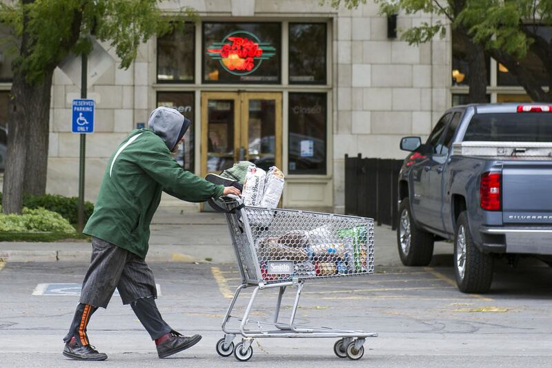 A homeless man walks past the Rio Grande Cafe in Salt Lake City on Monday, Oct. 3, 2016.