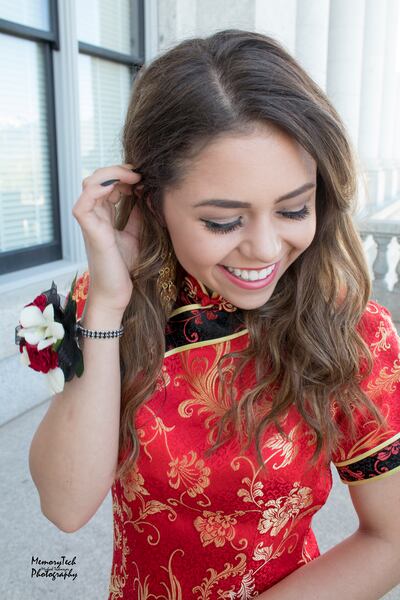Keziah Daum poses for a prom photo at the state Capitol in Salt Lake City on April 21, 2018. The Utah student wore a Chinese dress called a cheongsam to prom, though she is not Chinese.