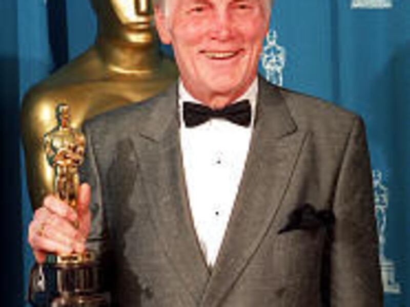 Jack Palance holds his Oscar backstage at the 64th annual Academy Awards in Los Angeles in March 1992. He won the award for "City Slickers."