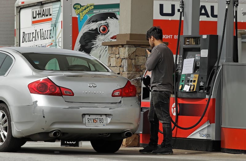 A customer pumps gasoline at a station that has run out of unleaded and mid-grade fuel, and has a $20.00 limit on super grade fuel.