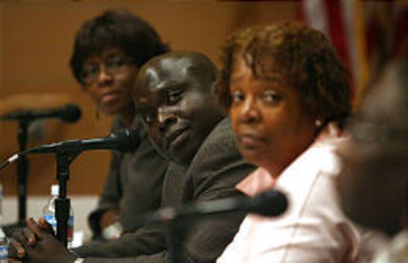 Sabina T. Zunguze, left, (Zimbabwe, Southern Africa), Denis LaSuba Paul (Uganda) and Dr. Eloise Skelton (Chicago) join Utah African-Americans and "continental black Africans" in Salt Lake Thursday.