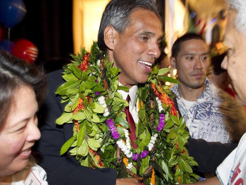 FILE - In this Nov. 2, 2010 file photo, Hawaii gubernatorial candidate James "Duke" Aiona, center, is greeted by supporters at the Hawaii Republican campaign headquarters in Honolulu. Aiona will soon become the top fundraising and recruitment official for