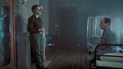 Oscar Isaac, left, stars as Peter Malkin and Ben Kingsley stars as Adolf Eichmann in “Operation Finale."