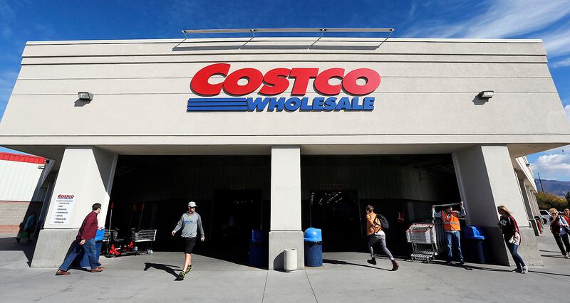 Customers enter and leave Costco in Salt Lake City ib Friday, Oct. 30, 2015.