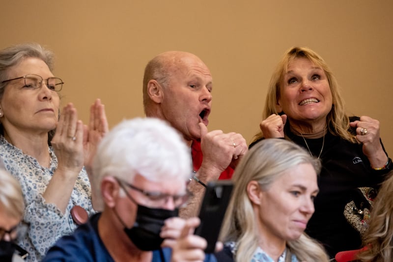 People in the Senate gallery celebrate after the Legislature successfully overrode the veto of HB11 at the Capitol in Salt Lake City.