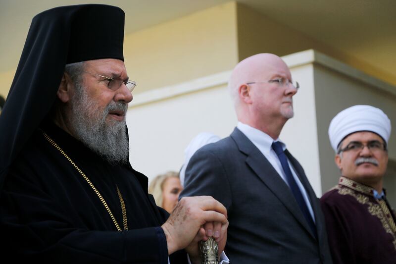 Shaun Casey, U.S. State Department Special Representative for Religion and Global Affairs, center, stands with the Greek Orthodox Christian Archbishop Chrysostomos, left, and Muslim Grand Mufti Talip Atalay, right, during statements to the press after the
