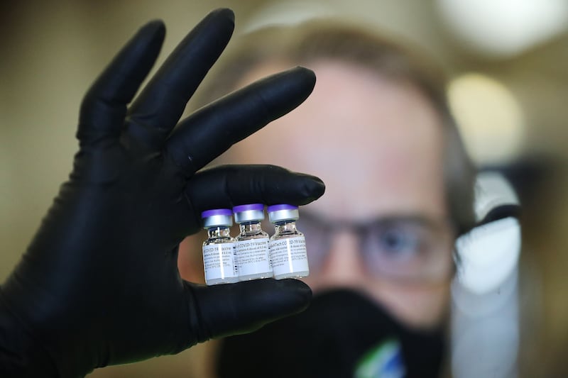 Richard Gatt holds vials of the Pfizer-BioNTech COVID-19 vaccine in Farmington on Thursday, May 13, 2021.