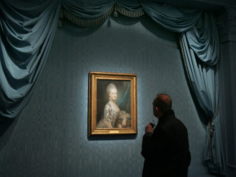 A member of the media views a portrait of Marie-Antoinette by French artist Joseph Ducreux at the Grand Palais museum in Paris in, 2008.