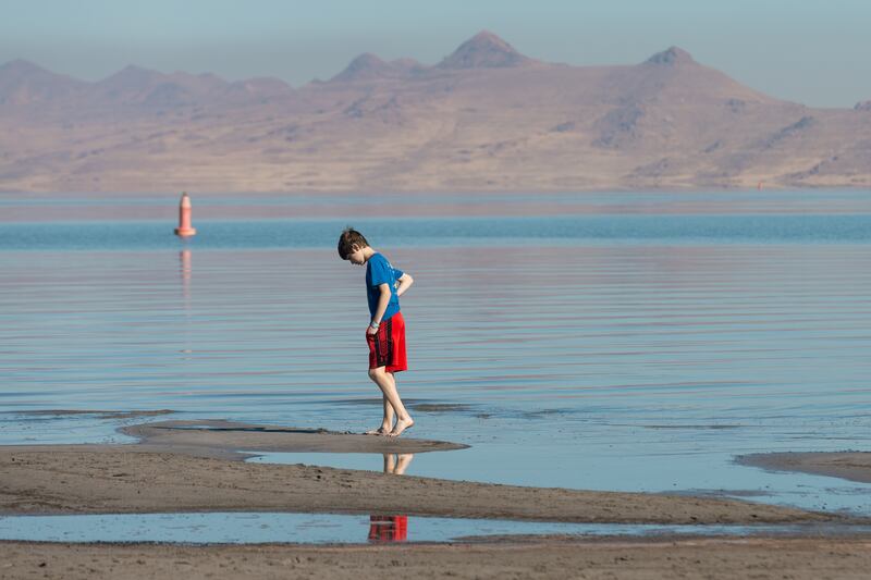 Isaiah Ingersoll walks on the beach at Great Salt Lake State Park in Magna on Oct. 6, 2023.