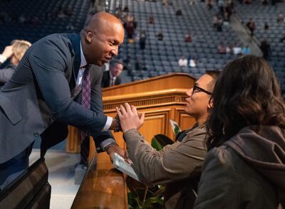 Bryan Stevenson, founder and executive director of the Equal Justice Initiative, greets an audience member after delivering the forum address at the Marriott Center on the BYU campus on Tuesday, Oct. 30, 2018.