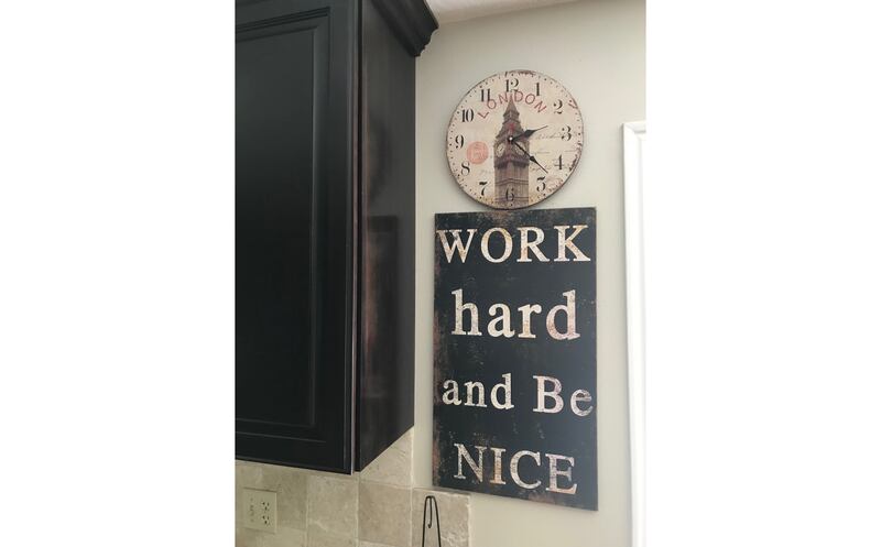 This “Work Hard and Be Nice” sign hangs in Kristine Frederickson’s home.