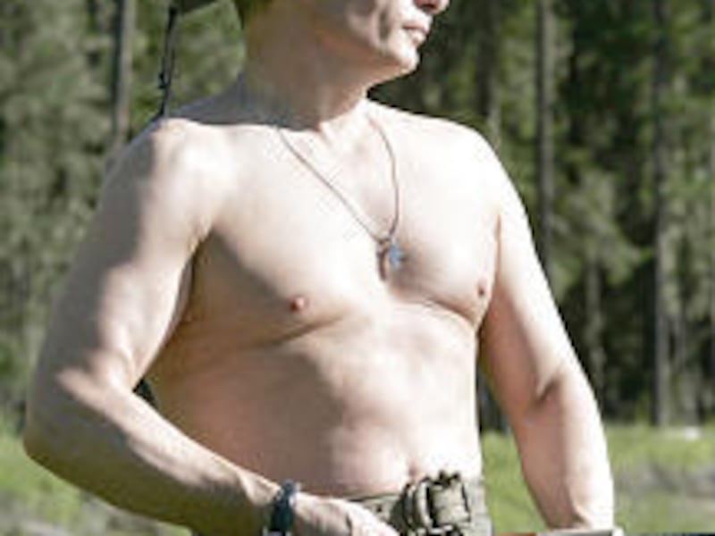 Russian President Vladimir Putin fishes in the Yenisey River in mid-August while on holiday.