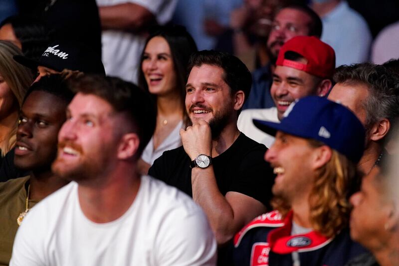 Actor Kit Harington watches as Irene Aldana fights Yana Kunitskaya in a UFC 264 event.