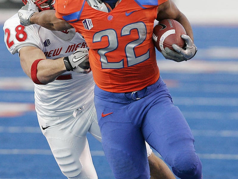 FILE - In this Dec. 3, 2011, file photo, Boise State running back Doug Martin (22) rushes past New Mexico's Bubba Forrest (28) during the first half of an NCAA college football game in Boise, Idaho. Martin was selected as the 31st pick overall by the Tamp