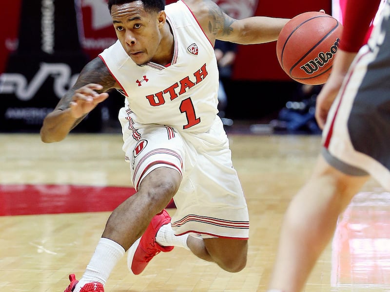 Utah Utes guard Justin Bibbins (1) fakes a drive as Utah and Washington State play an NCAA basketball game at the Huntsman Center in Salt Lake City on Sunday, Jan. 21, 2018.