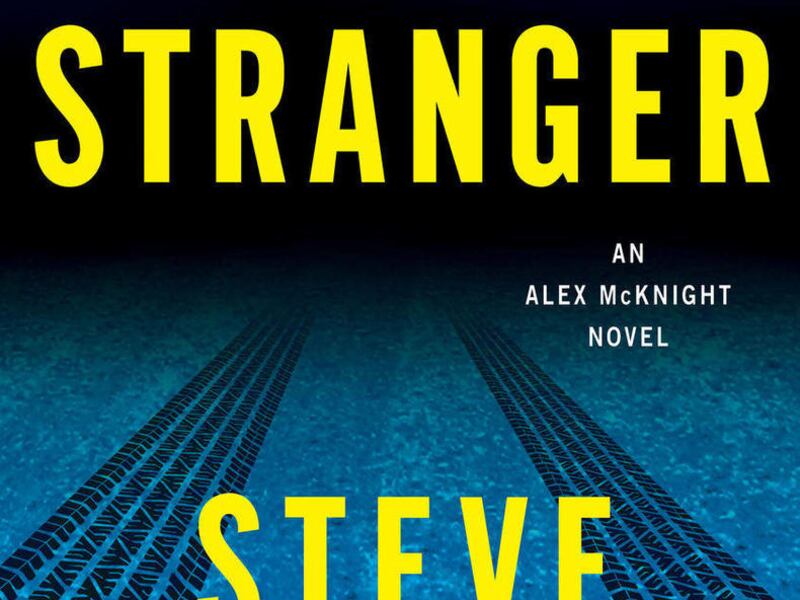 This book cover image released by Minotaur shows "Die a Stranger," by Steve Hamilton.