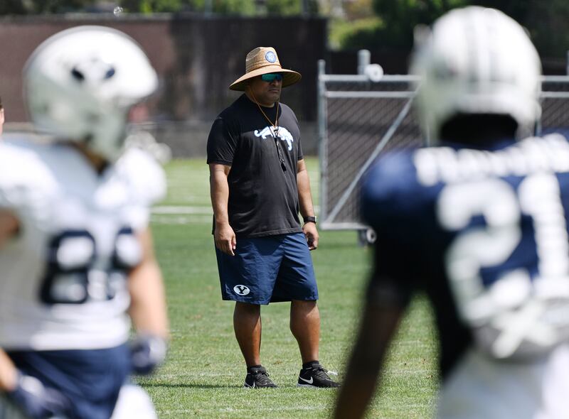 BYU coach Kalani Sitake watches his players during practice in Provo on Tuesday, Aug. 8, 2023.