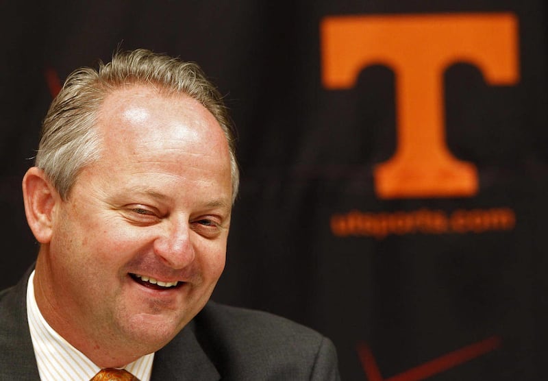 FILE - In this June 7, 2011, file photo, Mike Hamilton smiles during a news conference announcing is resignation as athletic director at the University of Tennessee in Knoxville, Tenn. Hamilton has accepted a job working for a nonprofit that supports ef