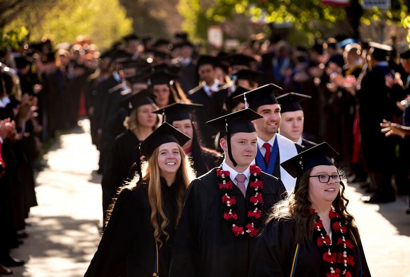 Graduating Southern Utah University students walk in the processional to the 123rd annual commencement in April 2022.