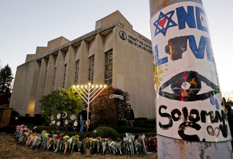 FILE - In this Dec. 2, 2018 photo, a menorah is tested outside the Tree of Life Synagogue in preparation for a celebration service at sundown on the first night of Hanukkah, in the Squirrel Hill neighborhood of Pittsburgh. A $6.3 million fund established