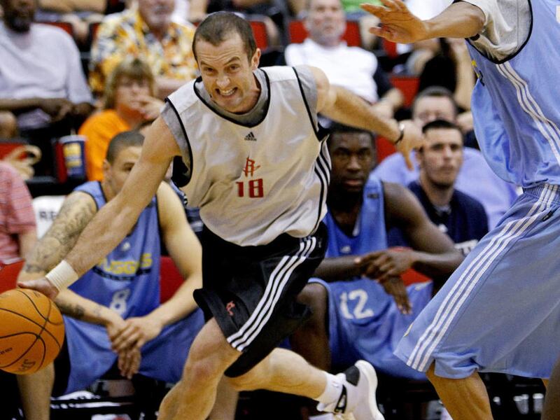Houston Rockets\' Blake Ahearn (18) drives past Denver Nuggets\' Romel Beck during an NBA summer league basketball game in Las Vegas on Wednesday, July 14, 2010.\r\n