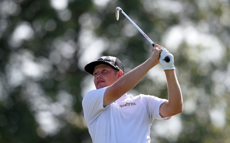 Zac Blair watches his tee shot form the 17th tee during the third round of the Quicken Loans National golf tournament, Saturday, June 30, 2018, in Potomac, Md.