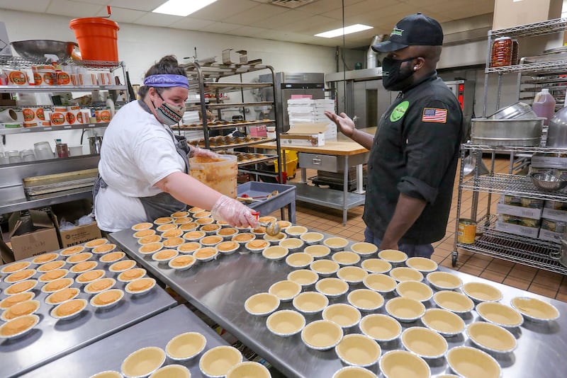 Paige Moore and James Edwards make gourmet pies in a shared commercial kitchen.