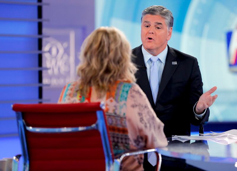 Fox News talk show host Sean Hannity interviews Roseanne Barr during a taping of his show, Thursday, July 26, 2018, in New York.