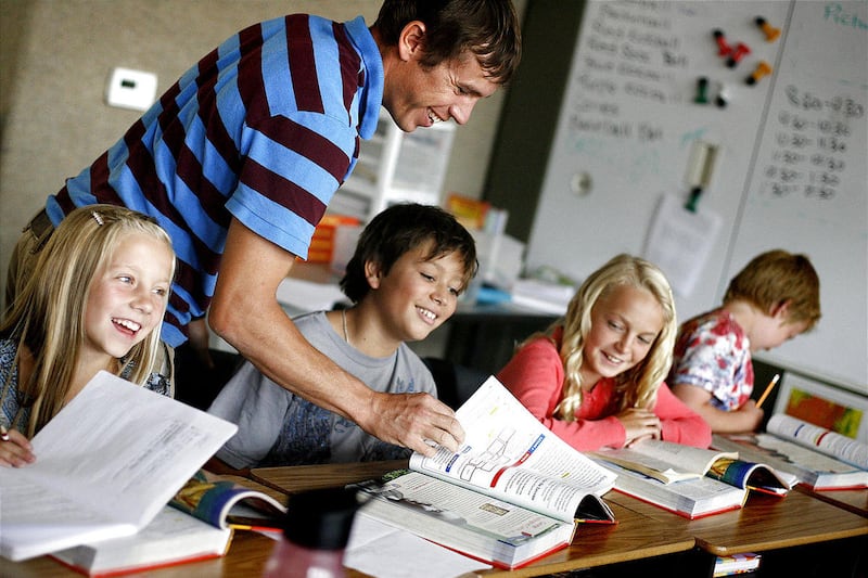 Social Studies teacher Josh Reinhart works with fifth graders (Left to right) Grace Patey, Tally Lagano, Claire Keiffer and Brody Dayton at the Soldier Hollow Charter School in Midway on Thursday, September 15, 2011. Soldier Hollow Charter School receiv
