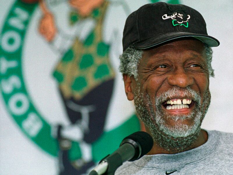 Boston Celtics center Bill Russell has a light moment while answering questions after a Celtics practice in Waltham, Mass.