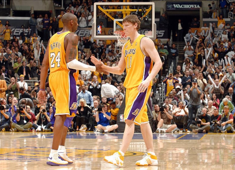 Lakers guards Kobe Bryant, left, and Coby Karl exchange high fives during a game earlier this season.
