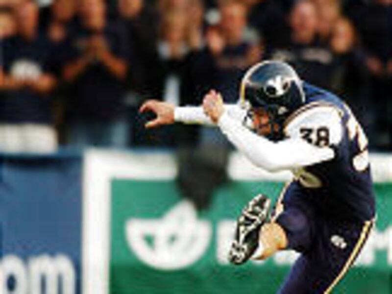 BYU senior Matt Payne unloads a kickoff Saturday against Notre Dame.