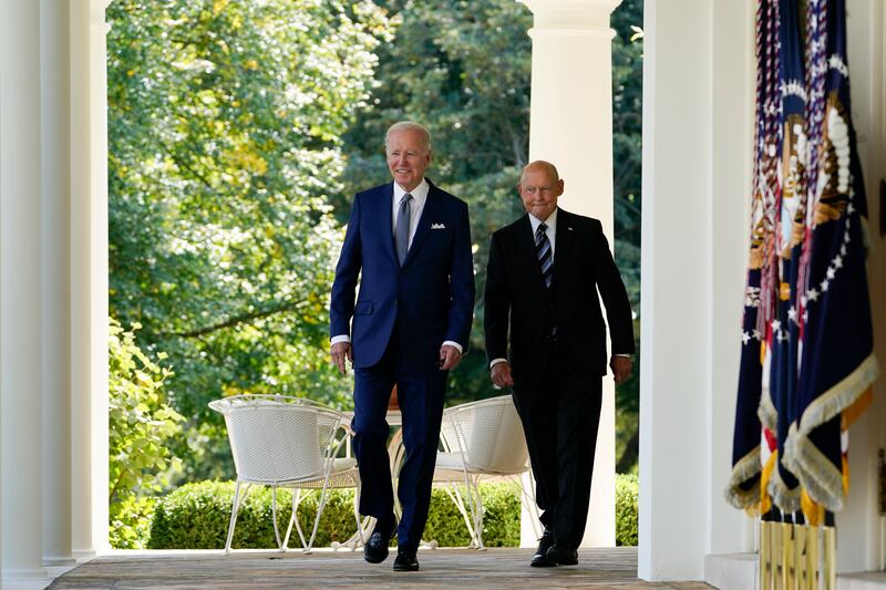 President Joe Biden walks with Bob Parant, Medicare beneficiary with Type 1 diabetes, in the Rose Garden of the White House,