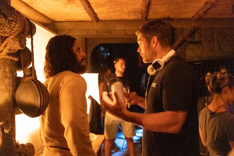 Actor Jonathan Roumie speaks with director Dallas Jenkins while filming Season 3 of “The Chosen.”