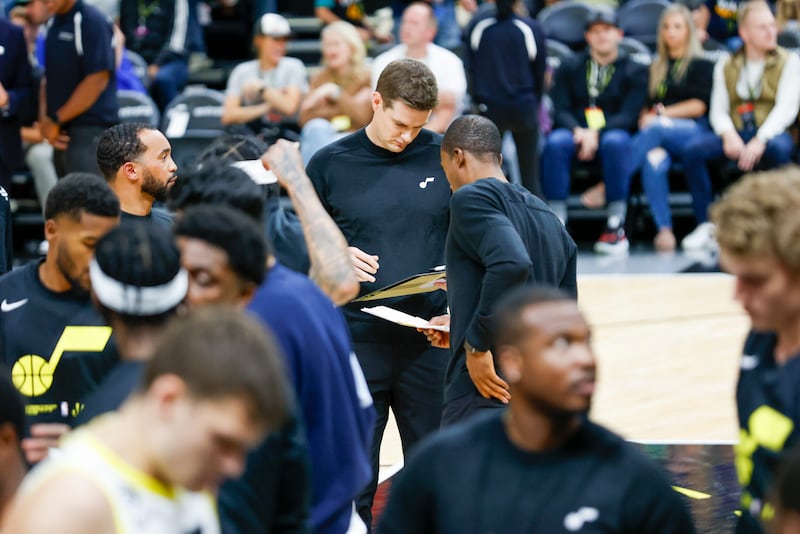 Will Hardy, the Jazz head coach, reviews his board during a timeout during a preseason game against the Mavericks in Salt Lake City on Friday, Oct. 14, 2022. The Mavericks won 115-101.
