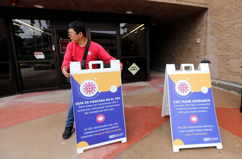 New signs at the Salt Lake County Government Center in Salt Lake City reflecting the Centers for Disease Control and Prevention’s updated guidance on masks