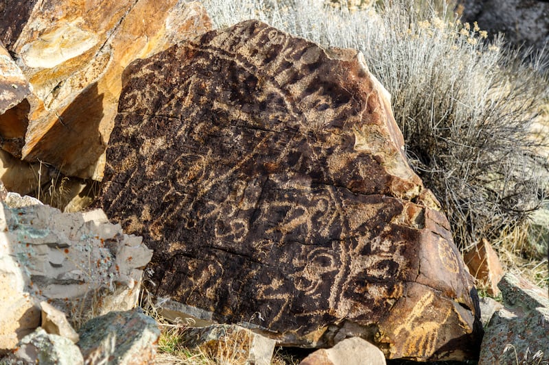 A petroglyph rock is returned to its place of origin in Northern Utah.