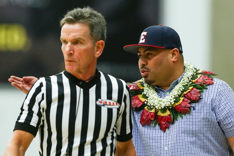 East Leopards head coach Olosaa Solovi speaks with the referee after a call was made against his player during the 5A semifinals of the girls basketball championship at the Lifetime Activities Center in Taylorsville on Friday, Feb. 22, 2019.