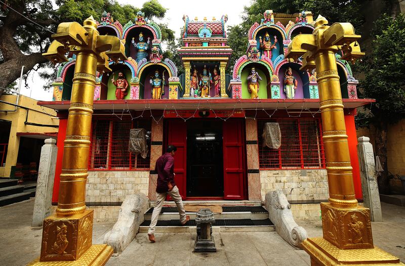 A man walks into a Hindu Temple in Bangaluru, India, on Thursday, April 19, 2018.