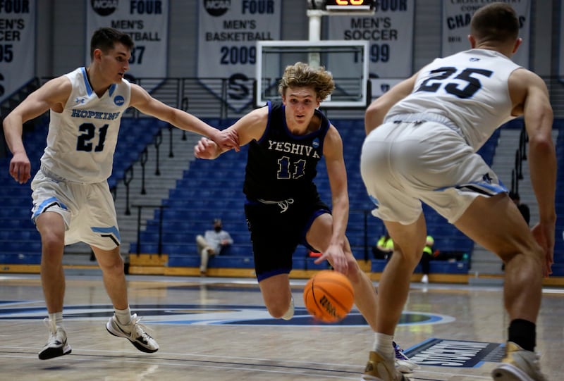 Yeshiva University’s Ryan Turell (11) dribbles the ball down court during the first round of the NCAA’s Division III basketball tournament, on Friday, March 4, 2022.