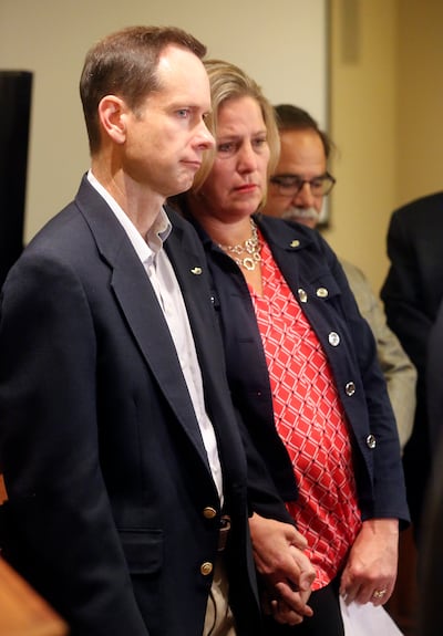 Matt and Jill McCluskey hold hands during a press conference at the offices of Siegfried and Jensen in Murray on Thursday, June 27, 2019. The McCluskeys are suing the University of Utah for $56 million, alleging the school failed to protect their daughter