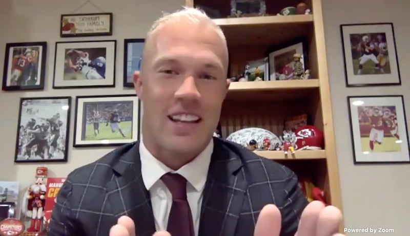 NFL football player and Latter-day Saint Daniel Sorensen smiles while telling a story during a devotional broadcast.