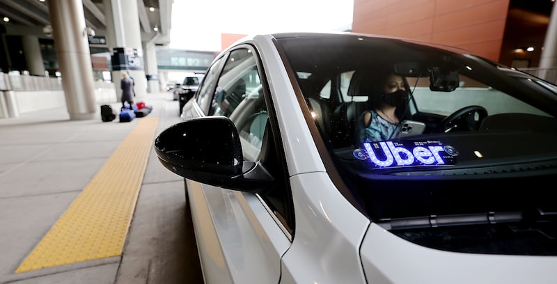 Uber driver Teresea Melendez waits for her passenger at the Salt Lake City International Airport.