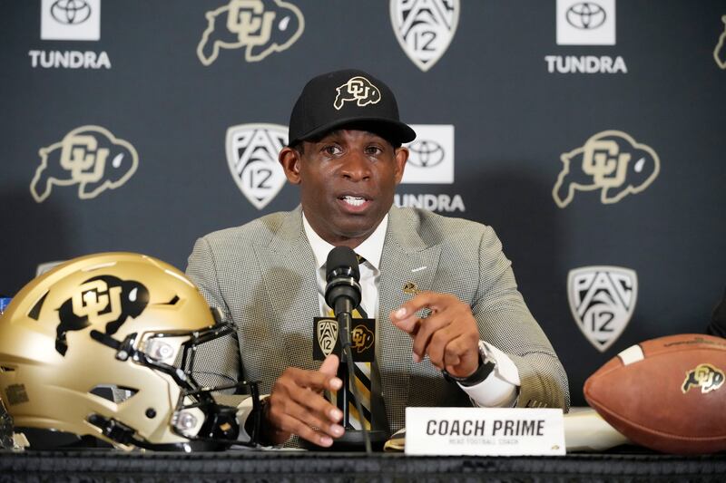 Deion Sanders speaks after being introduced as the new head football coach at the University of Colorado in December 2022.