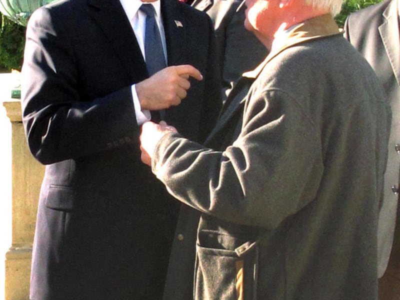 In this Nov. 3, 2010, photo, journalist Dick Wheeler, right, talks with Wisconsin Gov. Scott Walker the day after Walker won the election in Madison, Wis. Wheeler, who covered eight Wisconsin governors since moving to Wisconsin in 1972, died Friday, Nov.