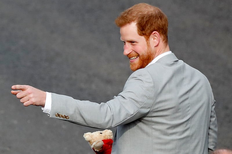 Britain’s Prince Harry reacts as he greets crowds in Windsor, near London, England, Friday, May 18, 2018. The English royal is set to star in a special to celebrate the 75th anniversary of Thomas the Tank Engine.