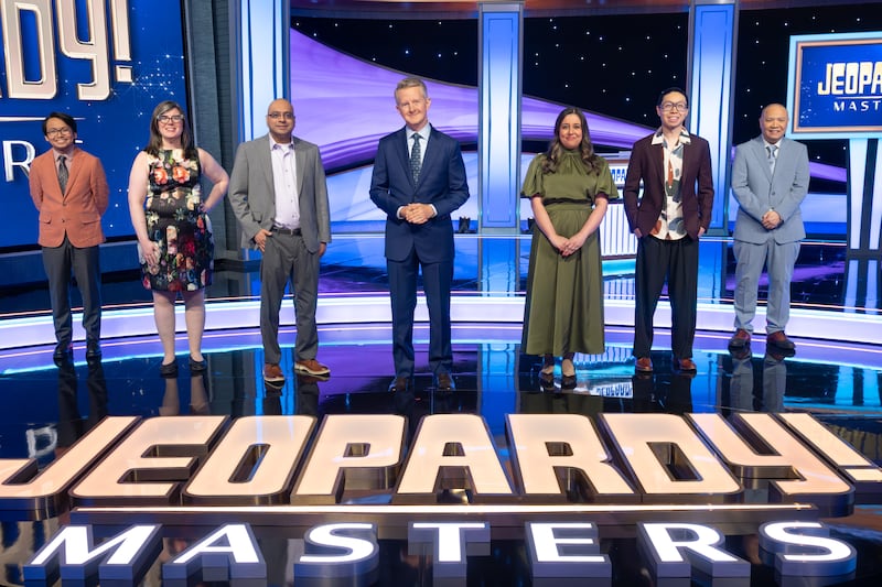 "Jeopardy!" Masters contestants Paolo Pasco, Victoria Groce, Yogesh Raut, Juveria Zaheer, Andrew He and Long Nguyen pose for a photo with host Ken Jennings.