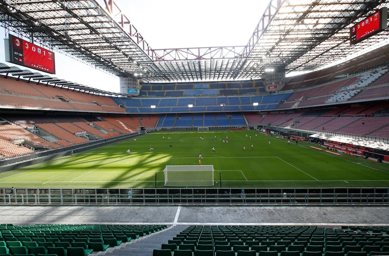 The empty San Siro Stadium is pictured before the Series A soccer match between AC Milan and Genoa in Milan, Italy.