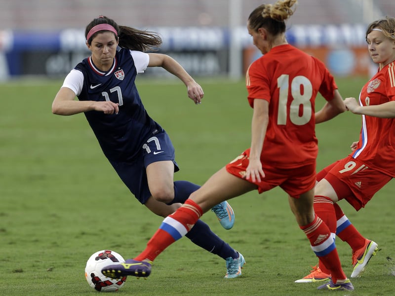 Russia's Elena Medved (18) blocks United States' Erika Tymrak (17) during an international friendly soccer match in Boca Raton, Fla., Saturday, Feb. 8, 2014. The U.S. won 7-0. (AP Photo/Alan Diaz)