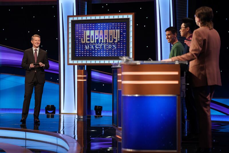 “Jeopardy!” host Ken Jennings chats with James Holzhauer, Andrew He and Mattea Roach during the semifinals of the Masters tournament.
